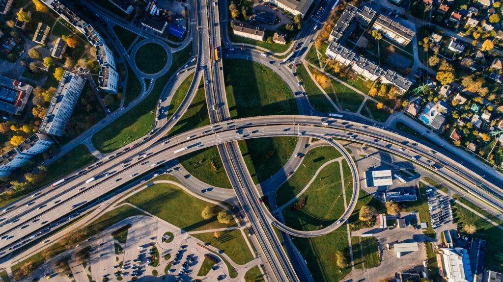 pexels photo 681335 681335 Aerial shot of a complex highway intersection in a vibrant urban cityscape.